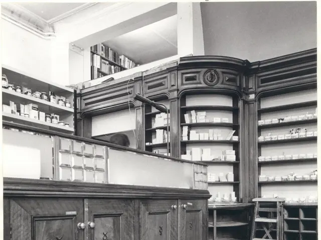 The image shows a black and white photo of a pharmacy with a counter, cupboards, a ladder, and...