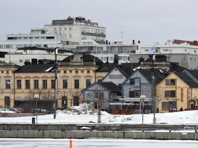 The image shows a cityscape with buildings, street poles, street lights, motor vehicles on the...