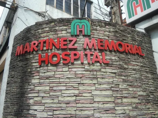The image shows the Martinez Memorial Hospital in Manila, Philippines. It is a building with...