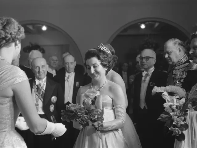 The image shows Queen Elizabeth II and Prince Philip, Duke of Edinburgh, on their wedding day. They...