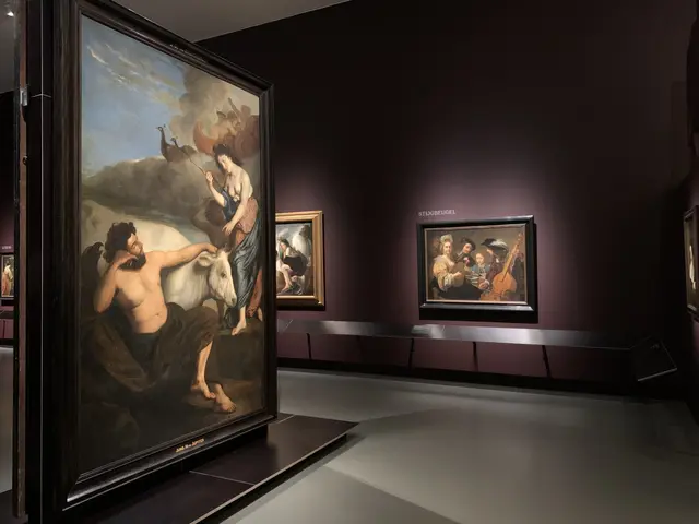The image shows a room filled with paintings on display in a museum, with photo frames on the walls...
