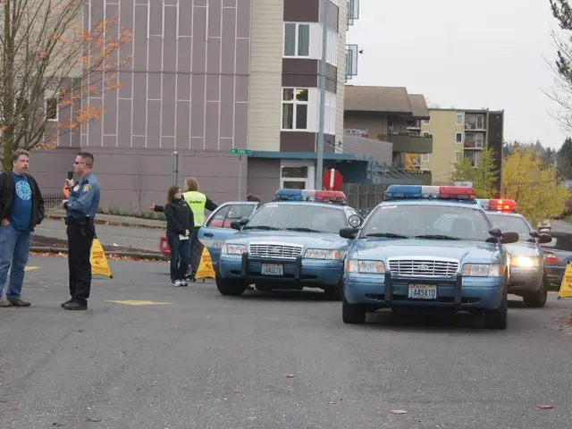 In this image, I can see the cars on the road. I can see four people standing. These are the...