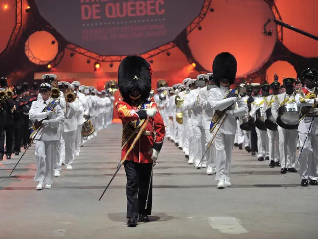 The image shows a group of people in uniform marching down a street, with some of them holding...