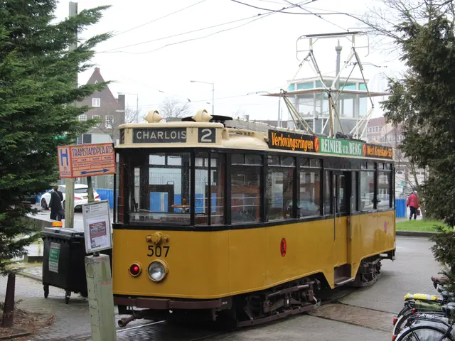 The image shows a yellow tram on a city street with bicycles parked on the side of it. There are...