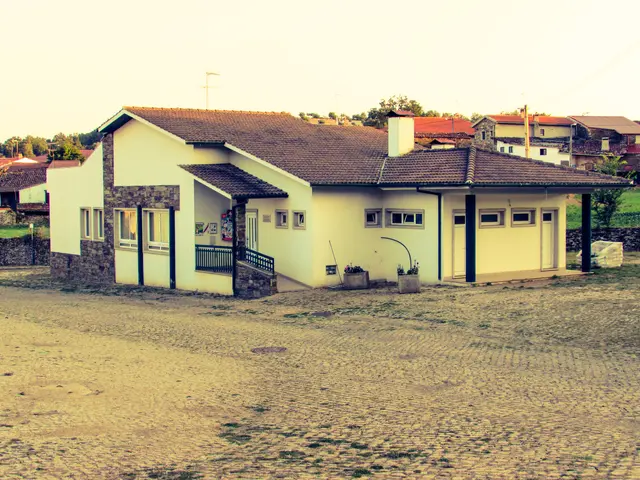 The image shows a house with a roof and windows, a fence, some plants in pots, grass, a group of...