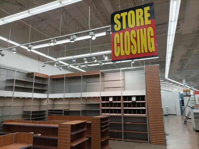 The image shows a store with a sign that reads "Store Closing" hanging from the ceiling. Inside the...