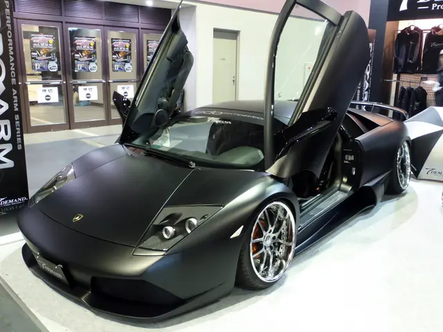 The image shows a black Lamborghini Murcielago LP670-4 Superveloce with its doors open, parked on...