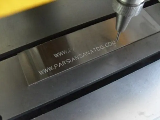 The image shows a CNC milling machine cutting a piece of metal with precision and accuracy. The...