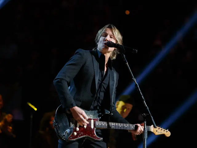 The image shows Keith Urban performing at the Joint at Hard Rock Hotel & Casino in Las Vegas. He is...