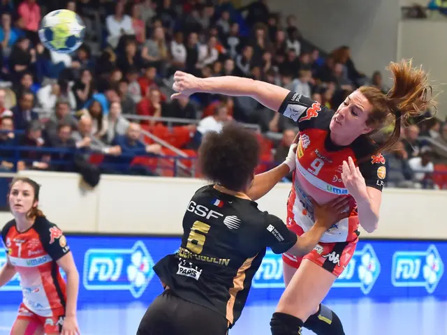 The image shows a group of women playing a game of handball on a court, with a ball in the air. In...