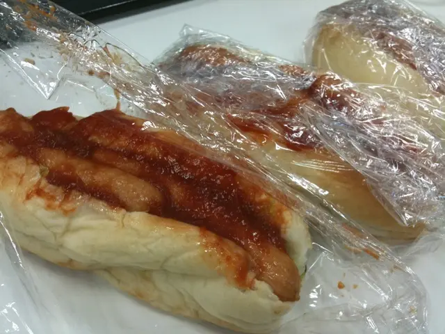 This image consists of sandwiches. In the middle, we can see hot dogs along with the ketchup are...