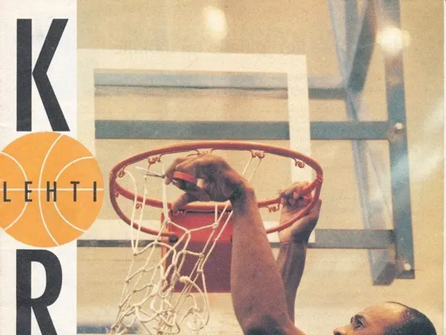 The image shows a man dunking a basketball into the hoop with a basketball net in the background....