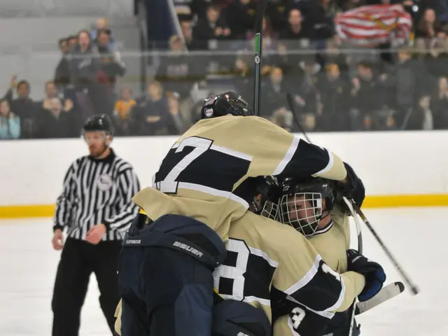 The image shows a group of hockey players huddled together on the ice, wearing sports dress,...