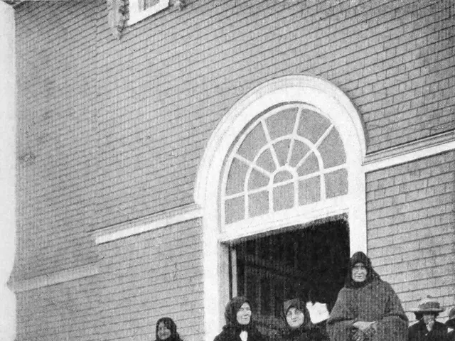 The image shows a group of women standing on the steps of a church, with a building in the...