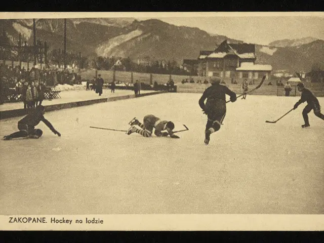 The image shows an old black and white photo of people playing hockey on an ice rink surrounded by...