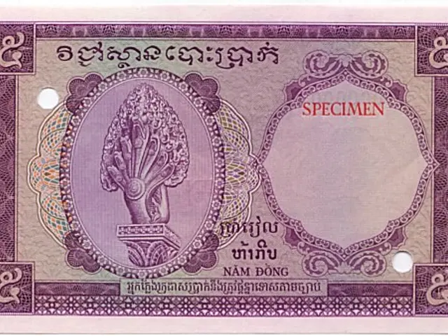 The image shows an old banknote from Thailand with a picture of a flower on it. The paper has text...