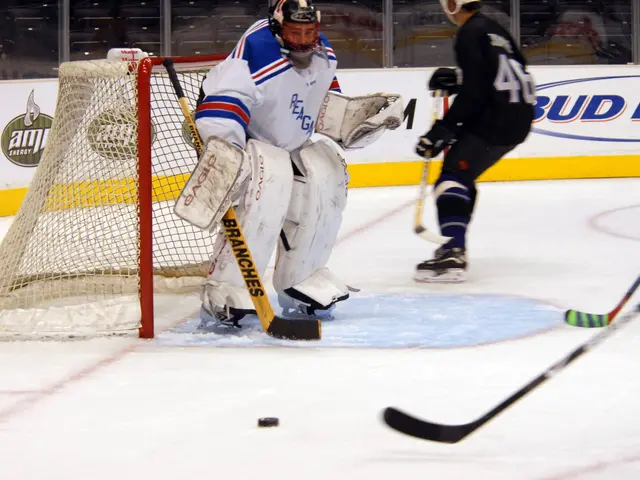 The image shows a group of people playing a game of hockey on an ice rink. They are all wearing...