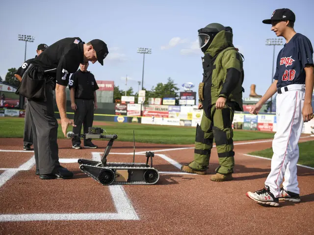 The image shows a group of people standing on top of a baseball field, with a robot in the center....