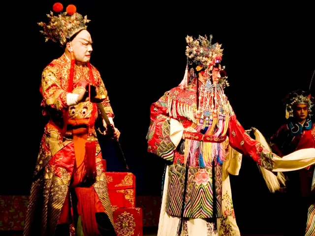 The image shows a group of people wearing traditional Chinese costumes on a stage, with one person...