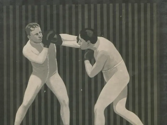 The image shows two men in a boxing ring, both wearing boxing gloves and engaged in a sparring...
