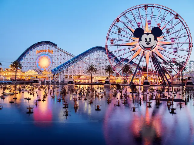 The image shows a vibrant scene of Disneyland's California Adventure at dusk, with a giant Mickey...