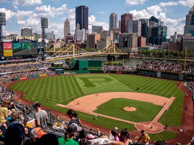 The image shows a baseball stadium filled with lots of people watching a game. The stadium is PNC...