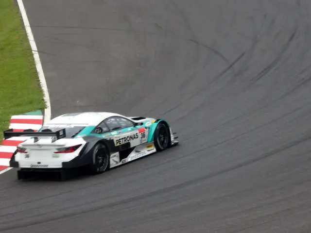 The image shows a Mercedes-AMG GT3 race car driving on a race track, with text on the car and grass...