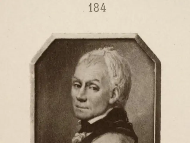 The image shows a black and white photo of Alexander Vassilievitch, a Russian composer, wearing a...