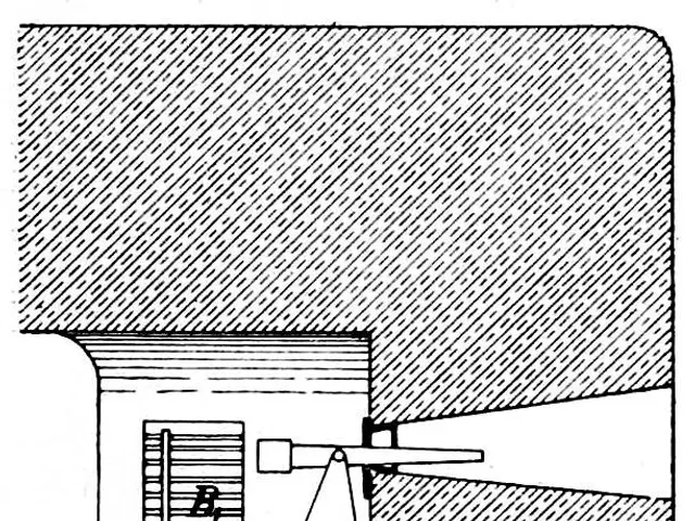 The image shows a black and white drawing of a machine with a light coming out of it, which appears...