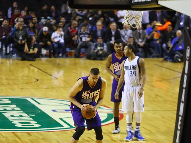 The image shows a basketball game between the Phoenix Suns and the Dallas Mavericks. We can see...