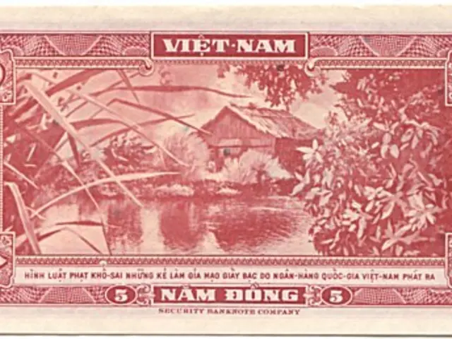 The image shows an old Vietnamese banknote with a picture of a house, trees, and water on it. The...