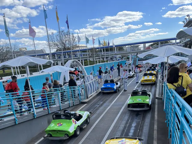 The image shows a group of people riding on top of a roller coaster at Disney's Hollywood Studios....
