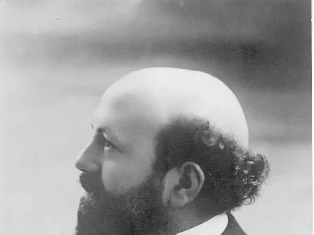 The image shows a black and white photo of August Scharrer, a German composer, wearing a blazer and...