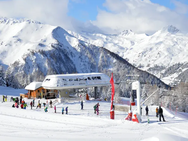 The image shows a group of people skiing down a snow covered slope in the Austrian Alps, surrounded...