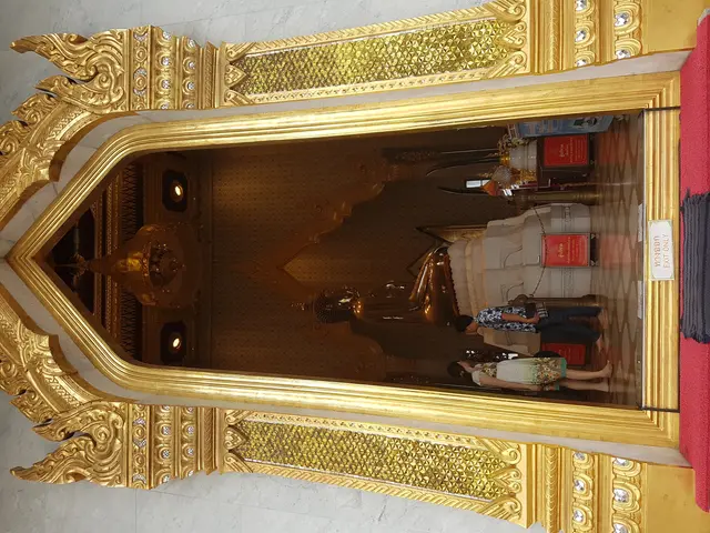 The image shows the interior of Wat Phra That Doi Suthep in Chiang Mai, Thailand. It features a...