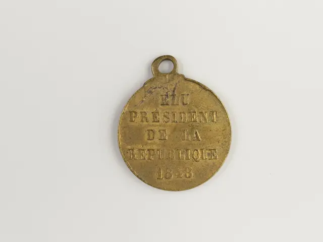 The image shows a gold medal with the words "President of the Republic" inscribed on it against a...