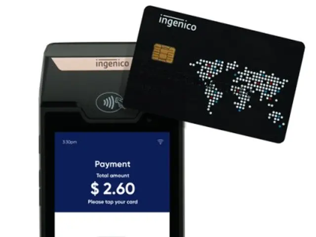 The image shows a mobile phone with a credit card next to it, indicating that it is an ingenico...
