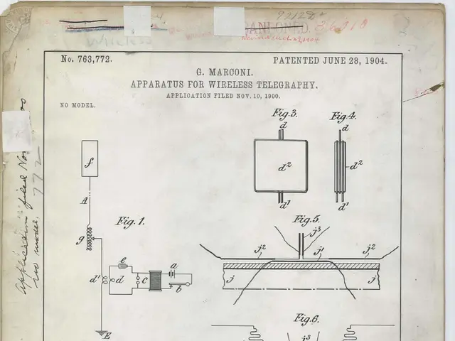 The image shows a paper with a drawing of a device on it, which appears to be a patent application...