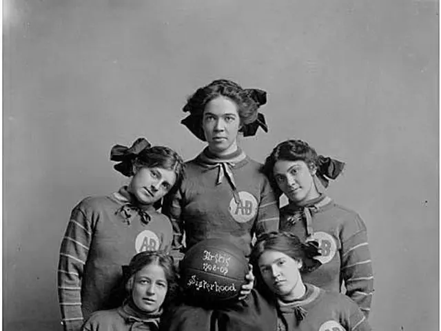 The image shows a black and white photo of a group of women from the Arctic Sisterhood Basketball...