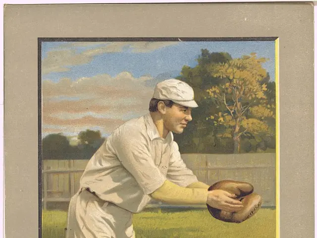 The image shows a baseball player wearing a cap and gloves, standing on a grassy field with a fence...
