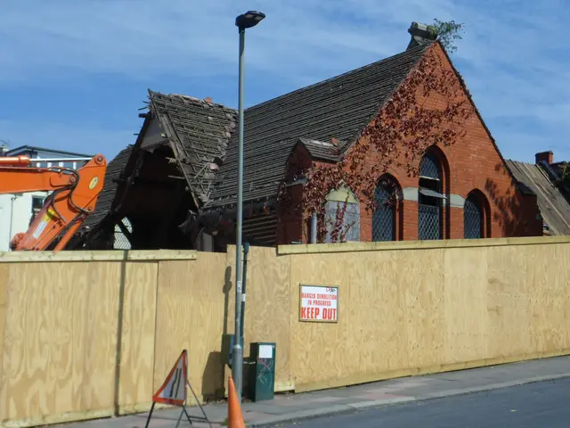The image shows a house with a wooden fence in front of it, an excavator, a street light, a trash...