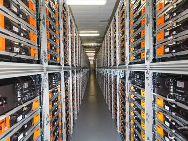 The image shows a long row of servers in a data center, with electronic devices in the racks and...