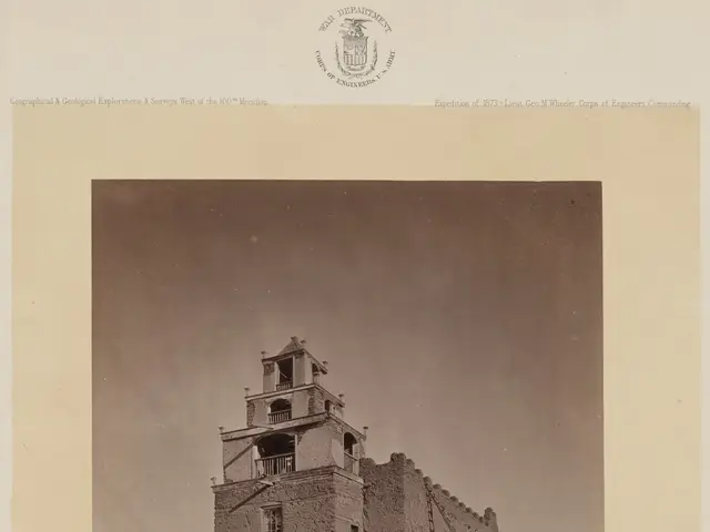 The image shows an old photo of the Church of San Miguel in Santa Fe, New Mexico. It is a building...