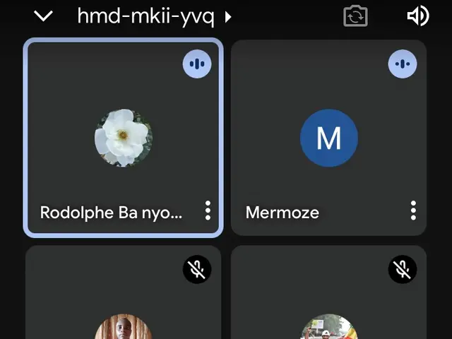 The image shows a screenshot of a cell phone with a group of people on the screen, along with text...
