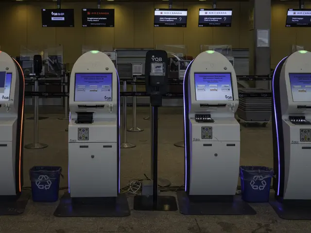 The image shows a row of automated teller machines sitting on top of a tiled floor, with dustbins,...