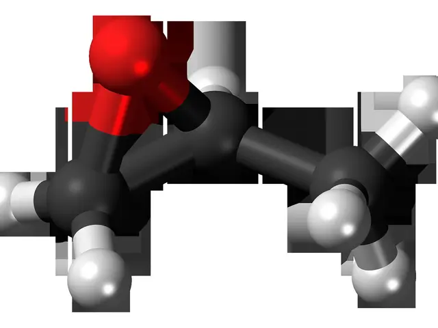 The image shows an animated molecular model of a benzene molecule with a red and black color scheme...