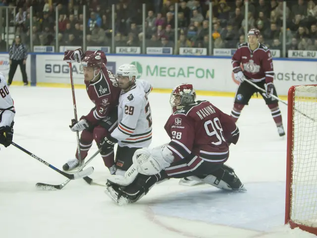 The image shows a group of people playing a game of hockey on an ice rink. They are all wearing...