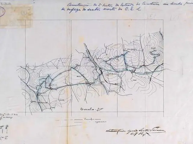 The image shows an old book with a drawing of a map on it, which is a topographic map of the city...