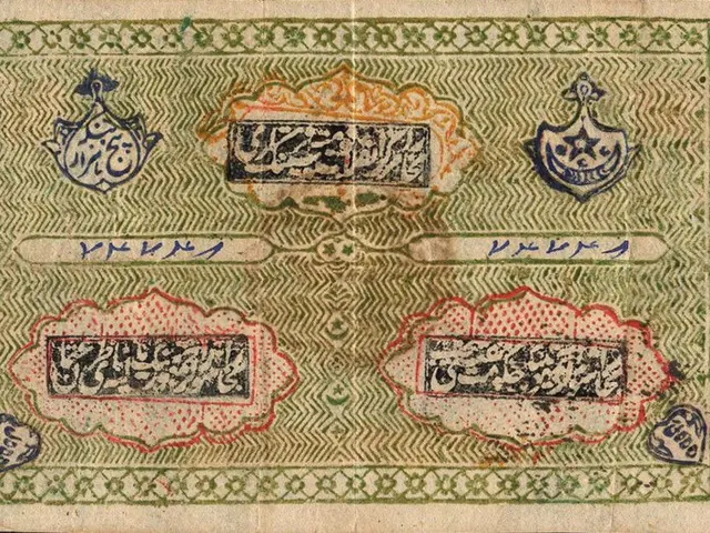 The image shows an old banknote with Arabic writing on it against a black background. The text on...
