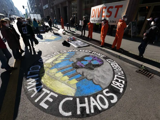 The image shows a group of people standing on the side of a street, some wearing masks and holding...